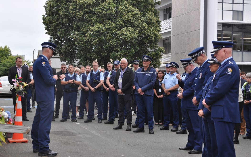 Police officers gather for a minute's silence to remember their colleague Senior Sergeant Lyn Fleming, who died after being struck by a vehicle while patrolling in central Nelson in the early hours of New Years Day.