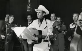 Hank Williams at the WSM radio studio, Nashville, c.1948.
Credit: Les Leverett Collection