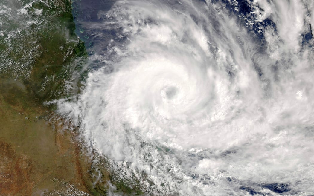 Cyclone Debbie can be seen closing in on the Australian coast in this NASA image.