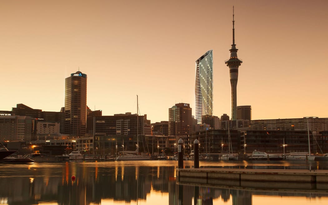 DXEY2J Sky Tower and Viaduct Harbour at dawn, Auckland, North Island, New Zealand