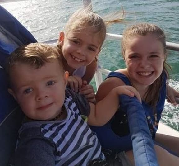 Joanne Kuzman's kids, including 11-year-old Samantha and 8-year-old Jessica.