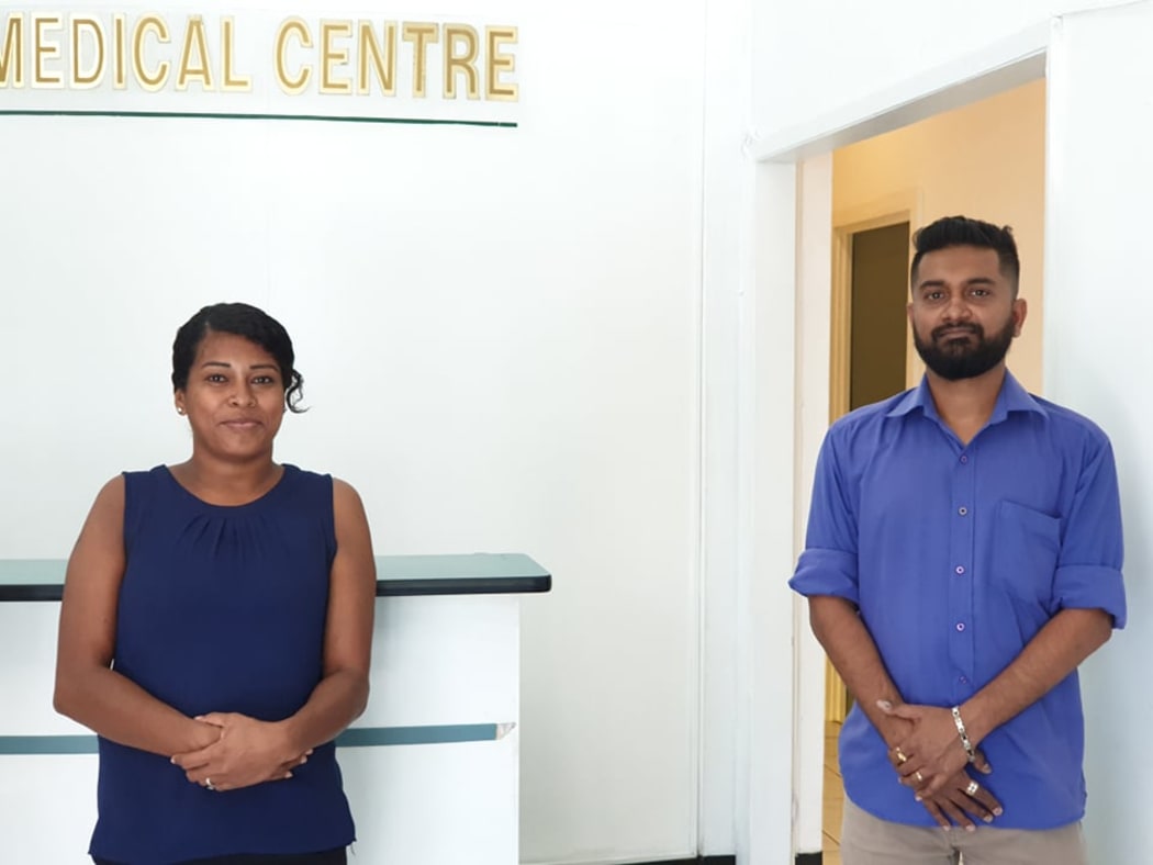 Dr Ashank Jyotish Naidu, (right), with a staff member at his medical clinic