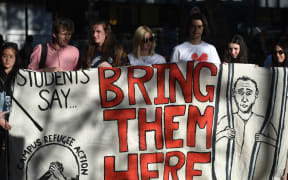 Refugee supporters in 2016 mark the milestone of 200 days of continuous protests in the detention camp on the Pacific island of Nauru.