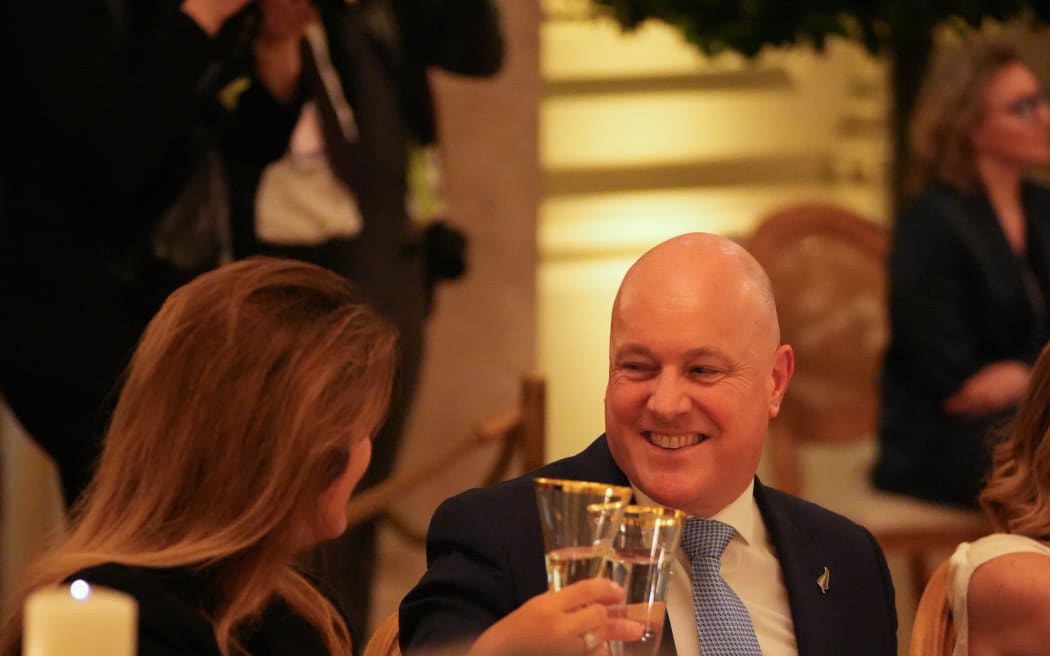 Prime Minister Christopher Luxon raises a glass at the White House during his trip to Washington DC to attend a NATO Summit.