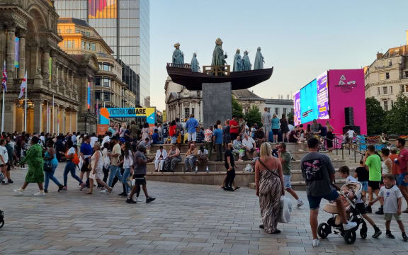 People watching the big screen of the closing ceremony at Victoria square in Birmingham.
