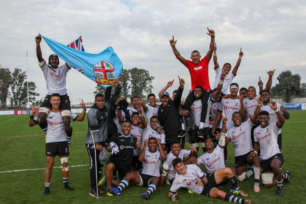 Fiji celebrate beating Scotland to retain their place in the World Rugby Under 20 Championship.