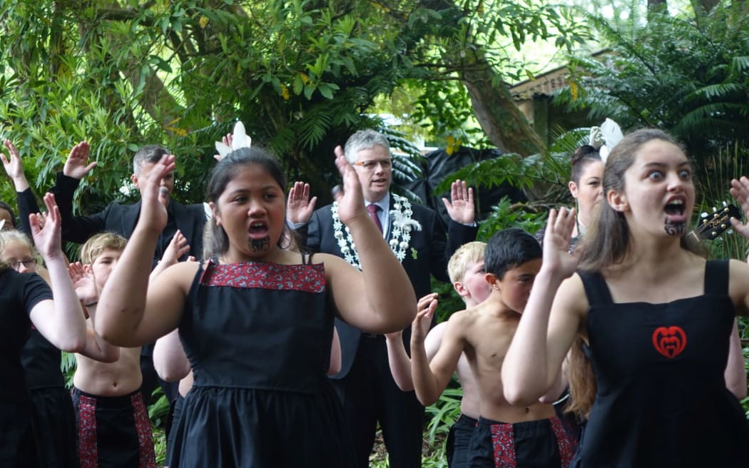 New Plymouth Mayor Andrew Judd joins students from St John Bosco and Sacred Heart Girls' College in welcoming the royal couple.
