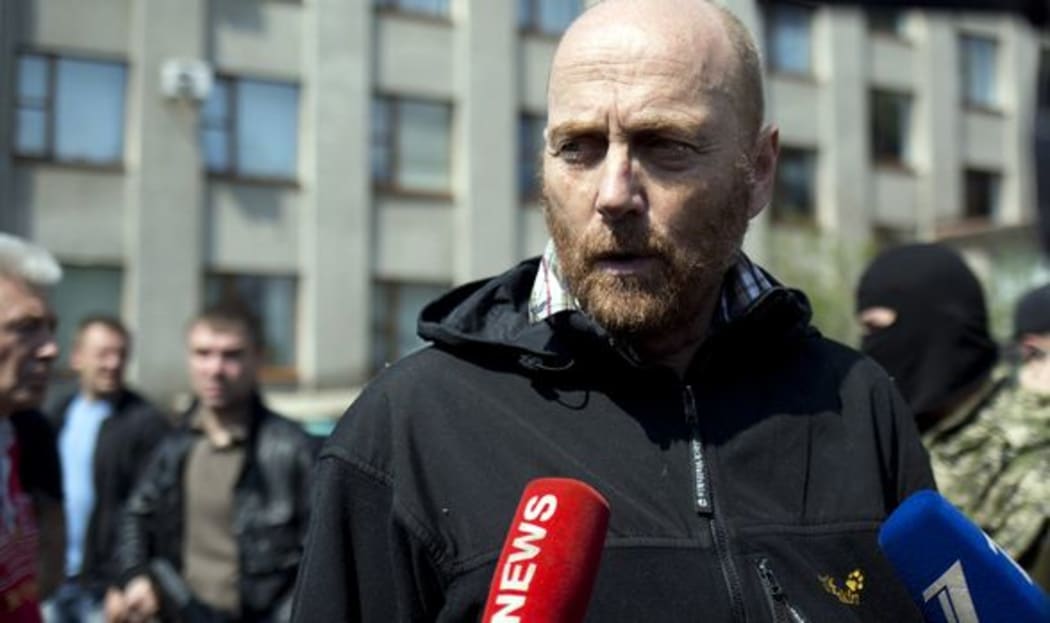 One of the freed OSCE observers, Colonel Axel Schneider, speaks to reporters in the southern Ukrainian city of Sloviansk.