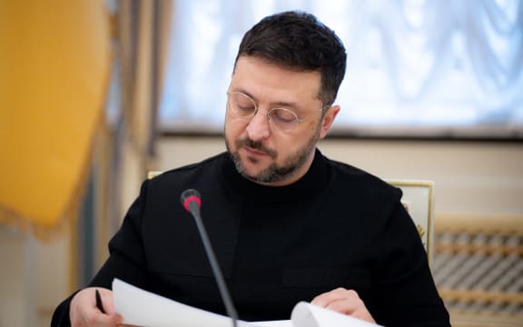 This handout photograph taken on 23 December, 2025 and released by the Ukrainian Presidential Office on 24 December, 2025 shows Ukraine's President Volodymyr Zelensky during a press conference with journalists in Kyiv.