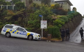 Armed police hunt for Black Power member Fenna Karaitiana in New Plymouth.
