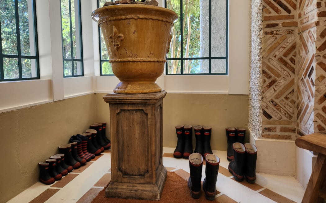 Gumboots lined up at the entry way to Wharekauhau Country estate