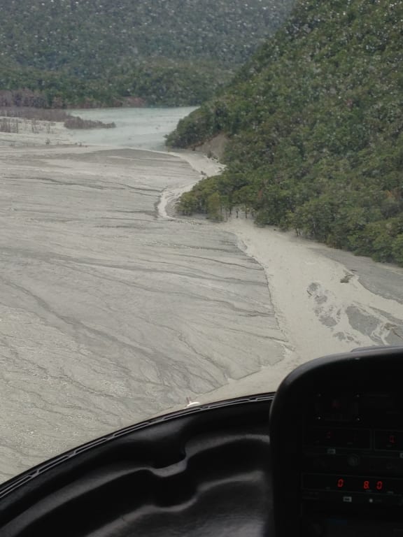 The river flowing over a band of silt.