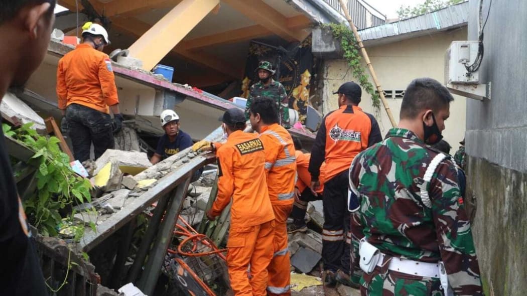 WEST SULAWESI, INDONESIA - JANUARY 15: Teams conduct search and rescue operations after a 6.2-magnitude earthquake hit Indonesia's West Sulawesi on January 15, 2021. 6.2-magnitude earthquake