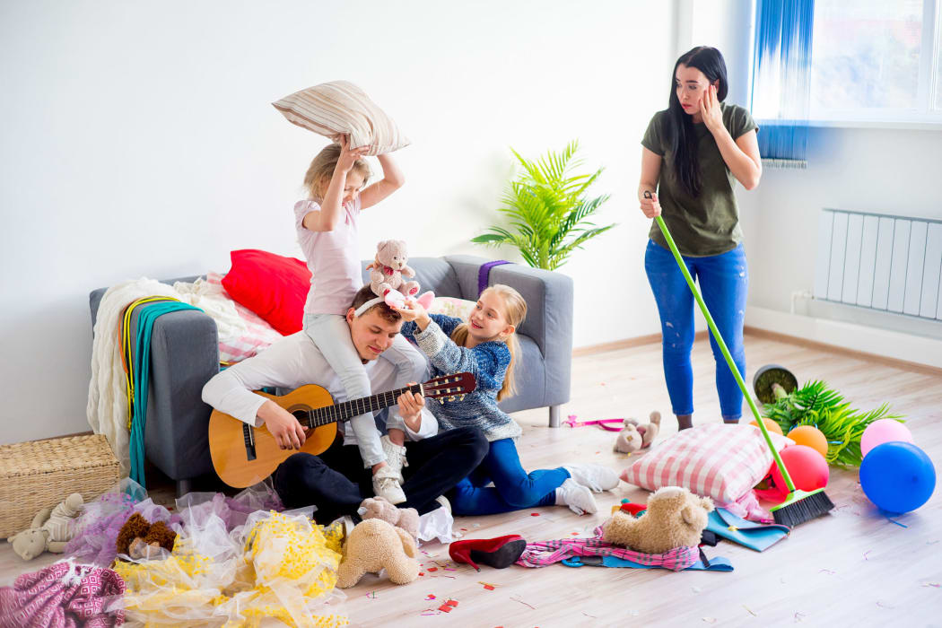 Mother is cleaning mess after her daughters played