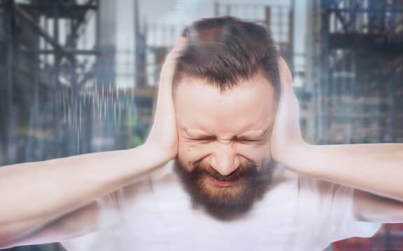 40131977 - people, life style  and emotional  concept - bearded man covering his ears by hands over white  background