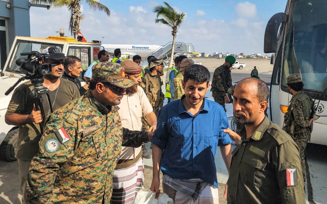Yemeni Huthi rebel prisoners are released during a prisoner exchange with the internationally recognised-government, on their way to board a flight to the Huthi-held capital Sanaa, from the country's southern city of Aden on April 14, 2023.