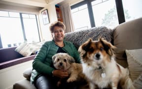Breast cancer survivor Maria Marama with her two dogs Kahu and Kyle