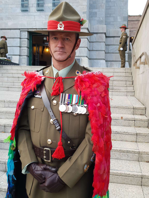 Warrant Officer Class One Robert Jobe wearing the cloak he wove.