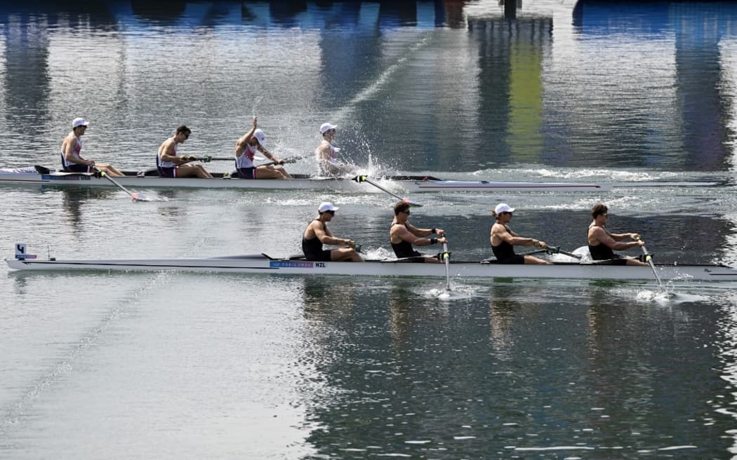 (TOP L-R) US' Nick Mead, Justin Best, Michael Grady and Liam Corrigan cross the finish line ahead of (BOTTOM L-R) New Zealand's Ollie Maclean, Logan Ullrich, Tom Murray and Matt Macdonald during the men's four final rowing competition at Vaires-sur-Marne Nautical Centre in Vaires-sur-Marne during the Paris 2024 Olympic Games on August 1, 2024. (Photo by Olivier MORIN / AFP)