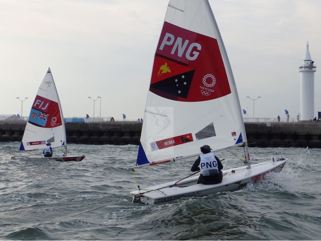 Fiji's Sophia Morgan and PNG's Rose-Lee Numa competing in the women's laser event in Tokyo.