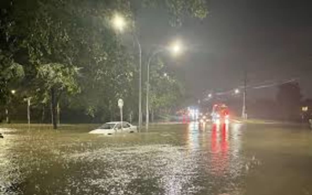 A car submerged during the Auckland Anniversary floods in February 2023.