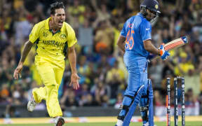Mitchell Johnson tears through the Indian attack.