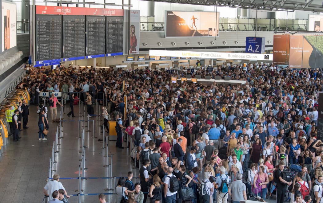 Thousands of passengers are crowded in Hall A in Terminal 1 of Frankfurt Airport due to a partial evacuation.