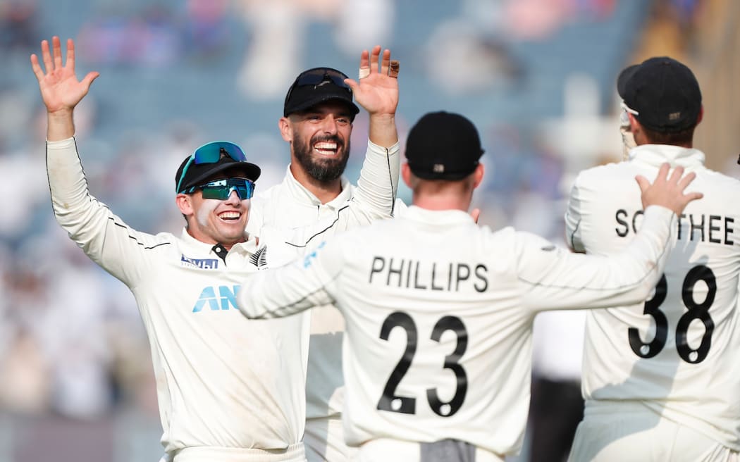 Tom Latham (c) of New Zealand and Daryl Mitchell of New Zealand celebrate.