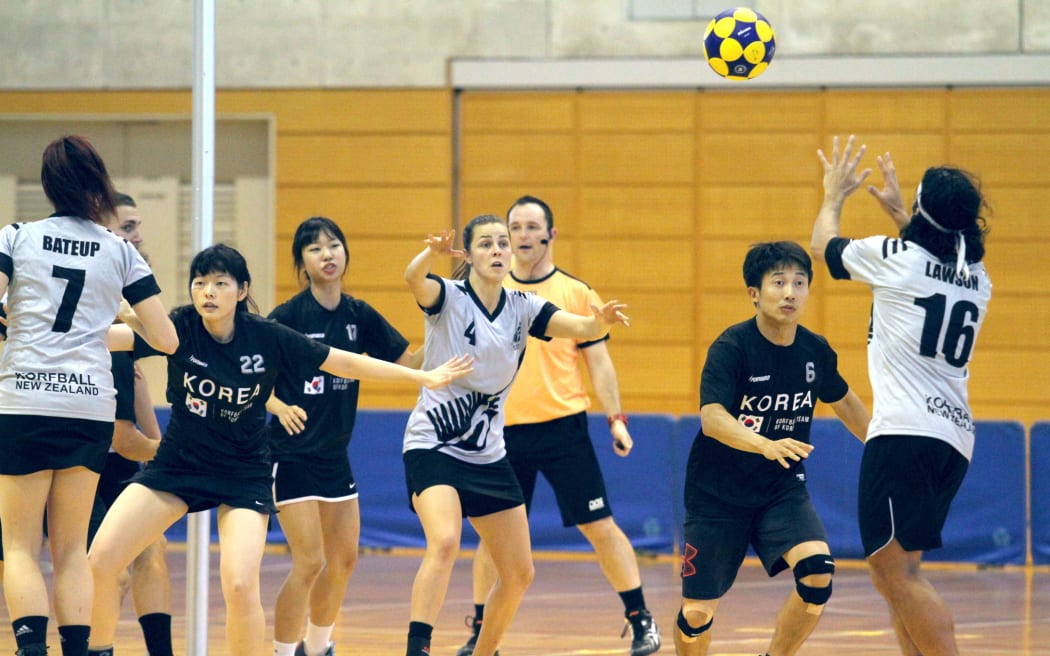 Koru captain Bevan Lawson takes a shot before his Korean opponent "defends" him during the Asia Oceania champs, where NZ qualified for the worlds for the first time.