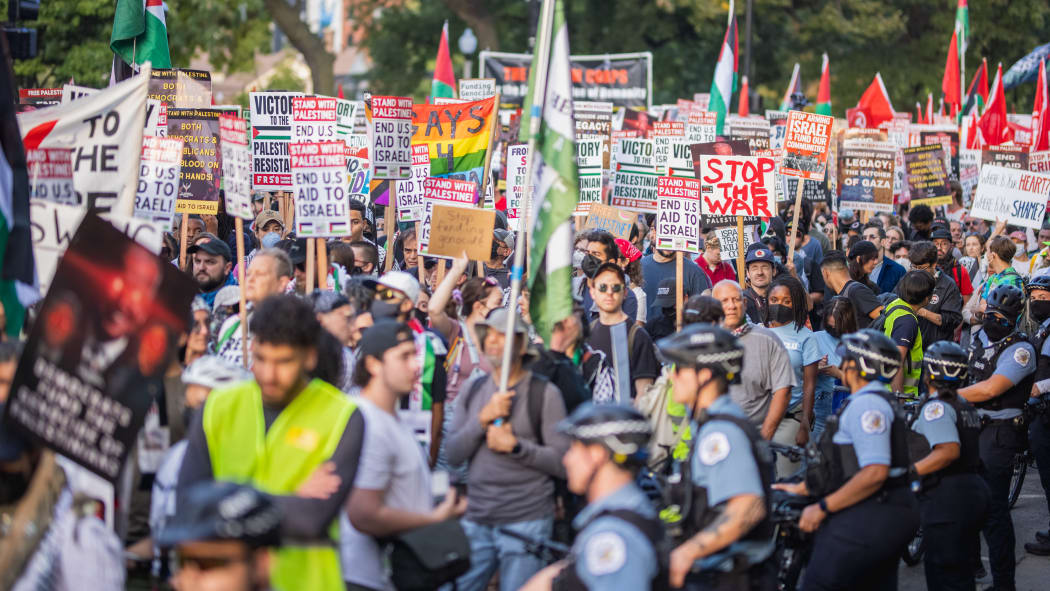 Thousands join the third March on DNC in Chicago, United States, on 22 August, 2024, demanding an end to the war on Gaza. After the march, a small group of protesters breaks off to try to block traffic.