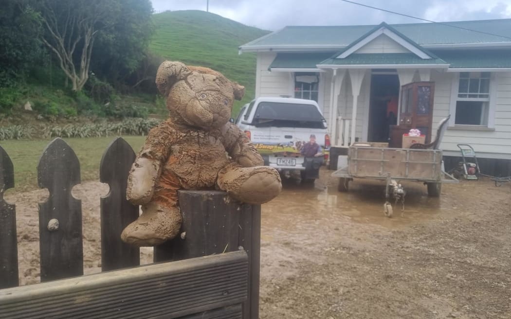 Friends and family help clean Christy Wright's flood damage home. A sudden Teddy keeps a vigil at Christy Wright's flood damaged home.
