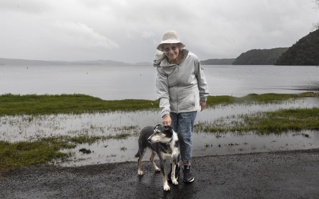 Maryann McCormick with her dog Skye outside her Lake Rotoiti property.