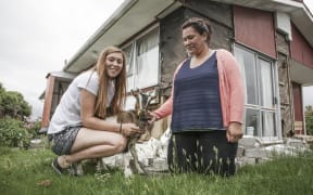 Alt text:
Karana Barker's house was destroyed in the 7.8 magnitude earthquake on November 14th. Karana pictured with Billy the goat and her daughter Annalise Barker.