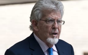 Australian entertainer Rolf Harris leaves Southwark Crown Court in London on May 30, 2017. Harris had been accused of four counts of indecent assault against three teenage girls between 1971 and 1983. He was found not guilty of the charges, with prosecutors saying they would not seek a retrial. (Photo by Justin TALLIS / AFP)