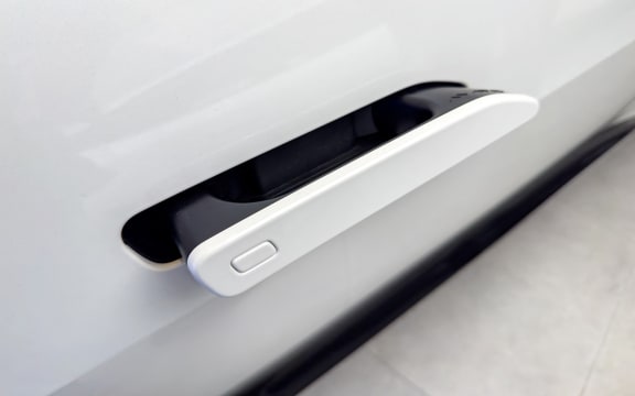 Hidden door handles showcased at Avatr Automotive Experience Center in Yangzhou, Jiangsu, China on November 4, 2025. (Photo by Chen Yang / CFOTO via AFP)