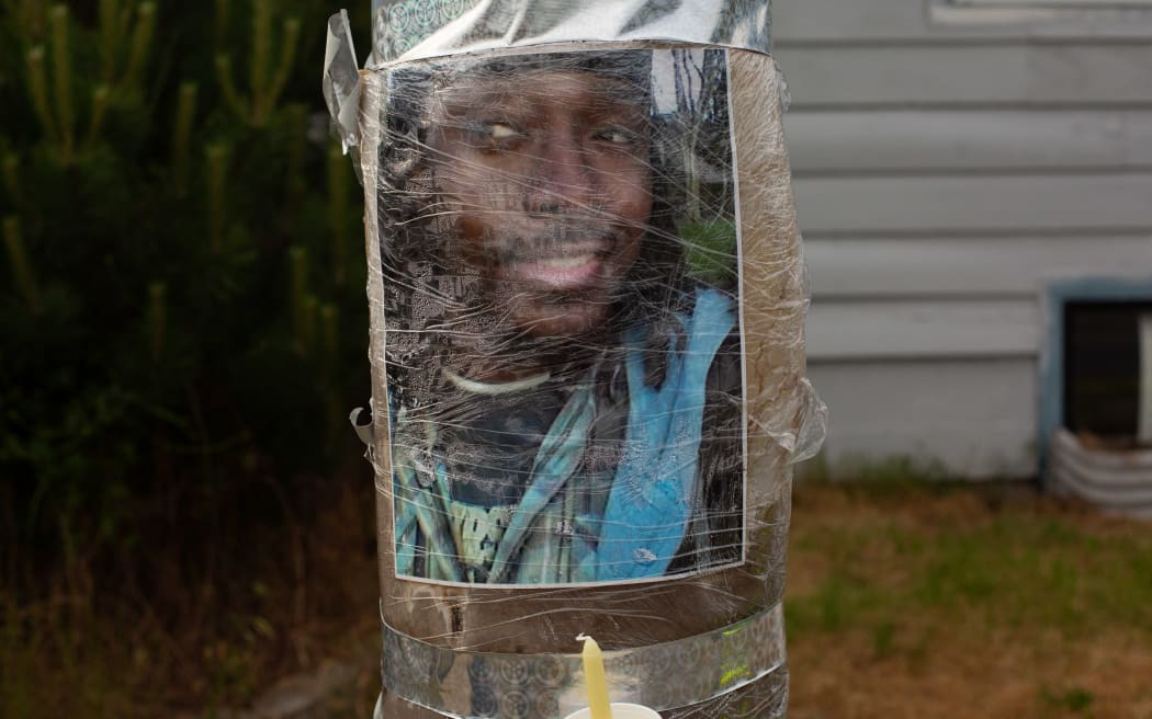 A photo of Manuel Ellis, a black man whose March death while in Tacoma Police custody was recently found to be a homicide, according to the Pierce County Medical Examiners Office, is seen near the site of his death during a vigil for him on June 3, 2020 in Tacoma, Washington. Protests and other events sparked by the death of George Floyd have continued in the Tacoma area after the Medical Examiner found that the cause of death in the Manuel Ellis case was caused by respiratory arrest due to hypoxia due to physical restraint.