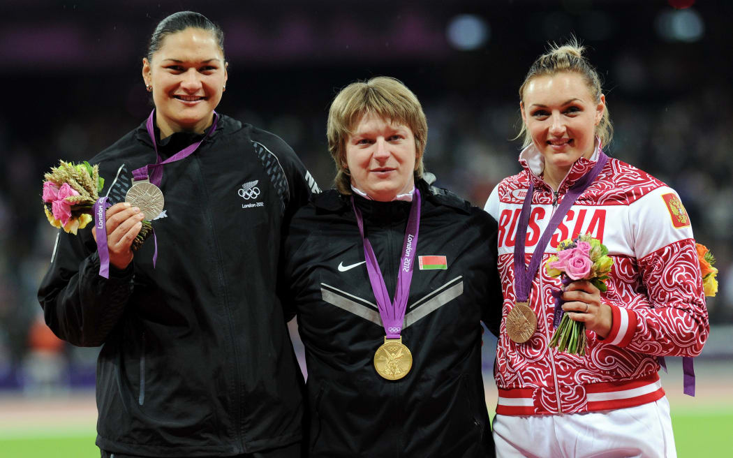 Valerie Adams received a silver medal at the London 2012 Olympics but was later promoted to first after Nadzeya Ostapchuk of Belarus, (middle) was disqualified for drug cheating.
