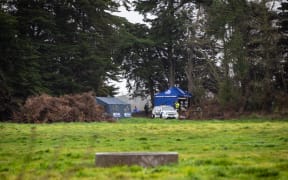 While searching private farmland in the Greenpark area in Canterbury, police found a shallow grave was discovered along the treeline.