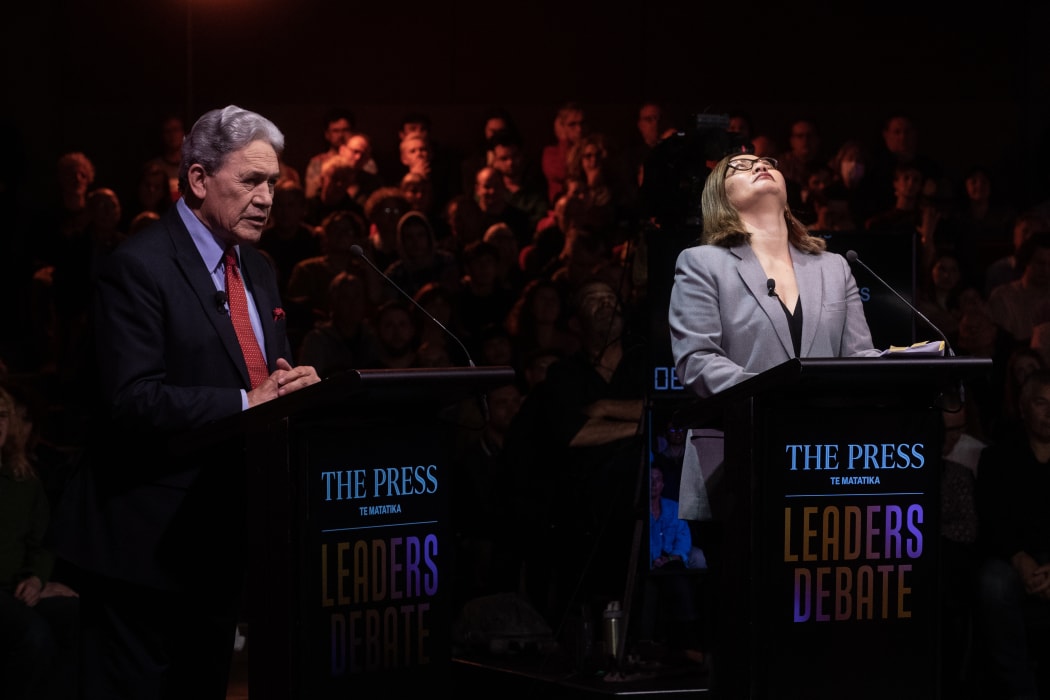 Green Party co-leader Marama Davidson searches for patience, next to NZ First's Winston Peters at The Press debate.