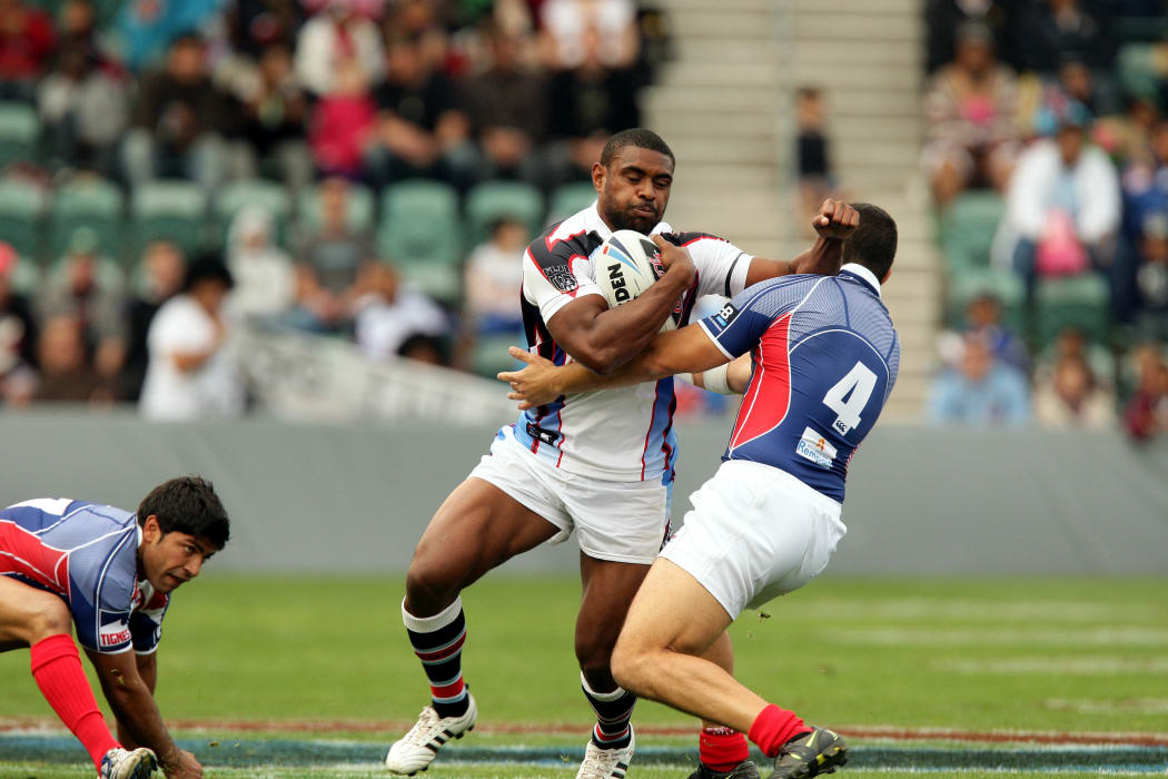 Wes Naiqama fends off the French defence during the 2008 World Cup.