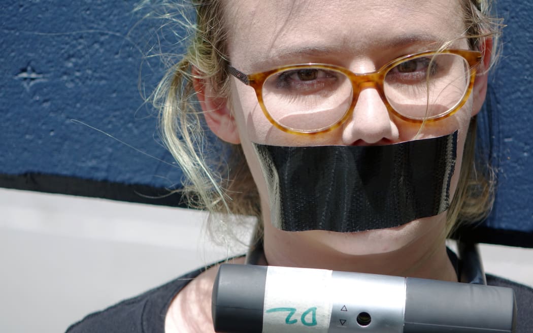 Tove Partington protests a police decision not to charge anyone over the so-called Roastbusters case.