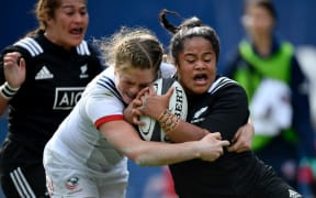 Black Ferns left wing Ayesha Leti-I'iga  is tackled by USA Eagles.