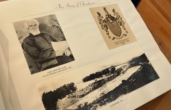 An open book shows a photograph of John Milsome Jury - a bearded man with wavy white hair - and an image of Glendower from 1908.