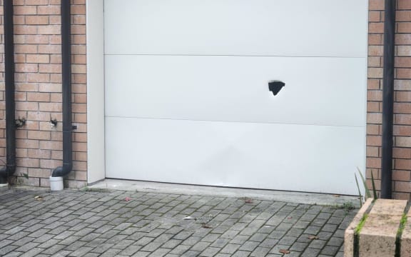 Bullet hole in garage door of Onehunga property