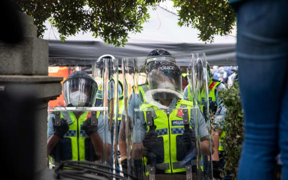 Police with shields.