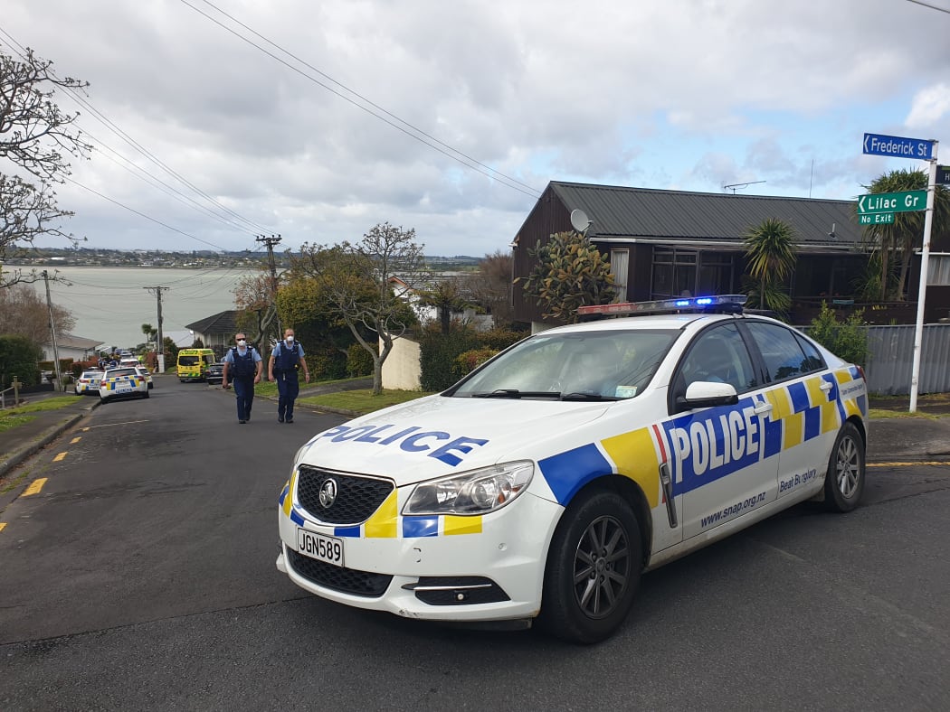Police on Lilac Grove, Hillsborough, after a person in possession of a firearm was shot by police and is in a serious condition following a chase that ended on the street.