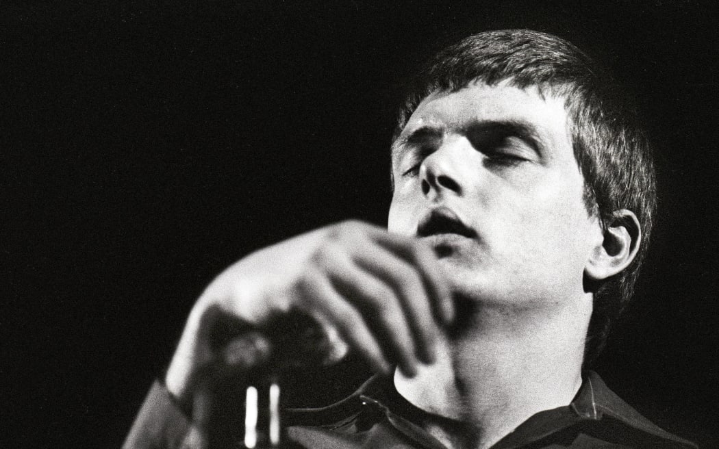 Photo of Joy Division, Ian Curtis performing live onstage at the Lantaren  (Photo by Rob Verhorst/Redferns)