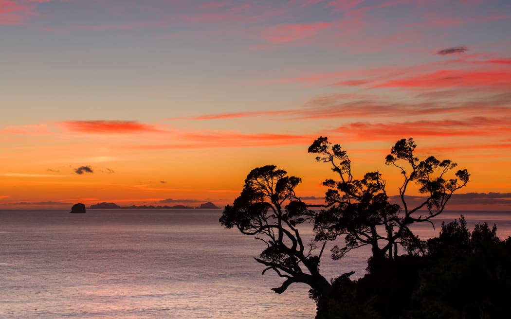 A dawn sky above the Alderman Islands in the South Pacific from New Zealand's Coromandel Peninsula, Waikato, North Island, New Zealand, Pacific (Photo by Garry Ridsdale / Robert Harding Premium / robertharding via AFP)
