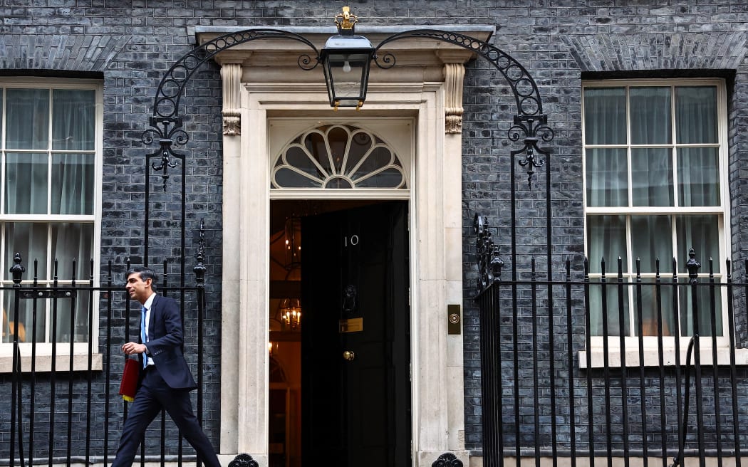 Britain's Prime Minister Rishi Sunak leaves from 10 Downing Street in central London, on January 24, 2024 to take part in the weekly session of Prime Minister's Questions (PMQs) in the House of Commons. (Photo by HENRY NICHOLLS / AFP)