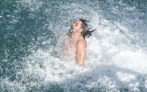 Kree Smith bursts from the water after his winning manu.